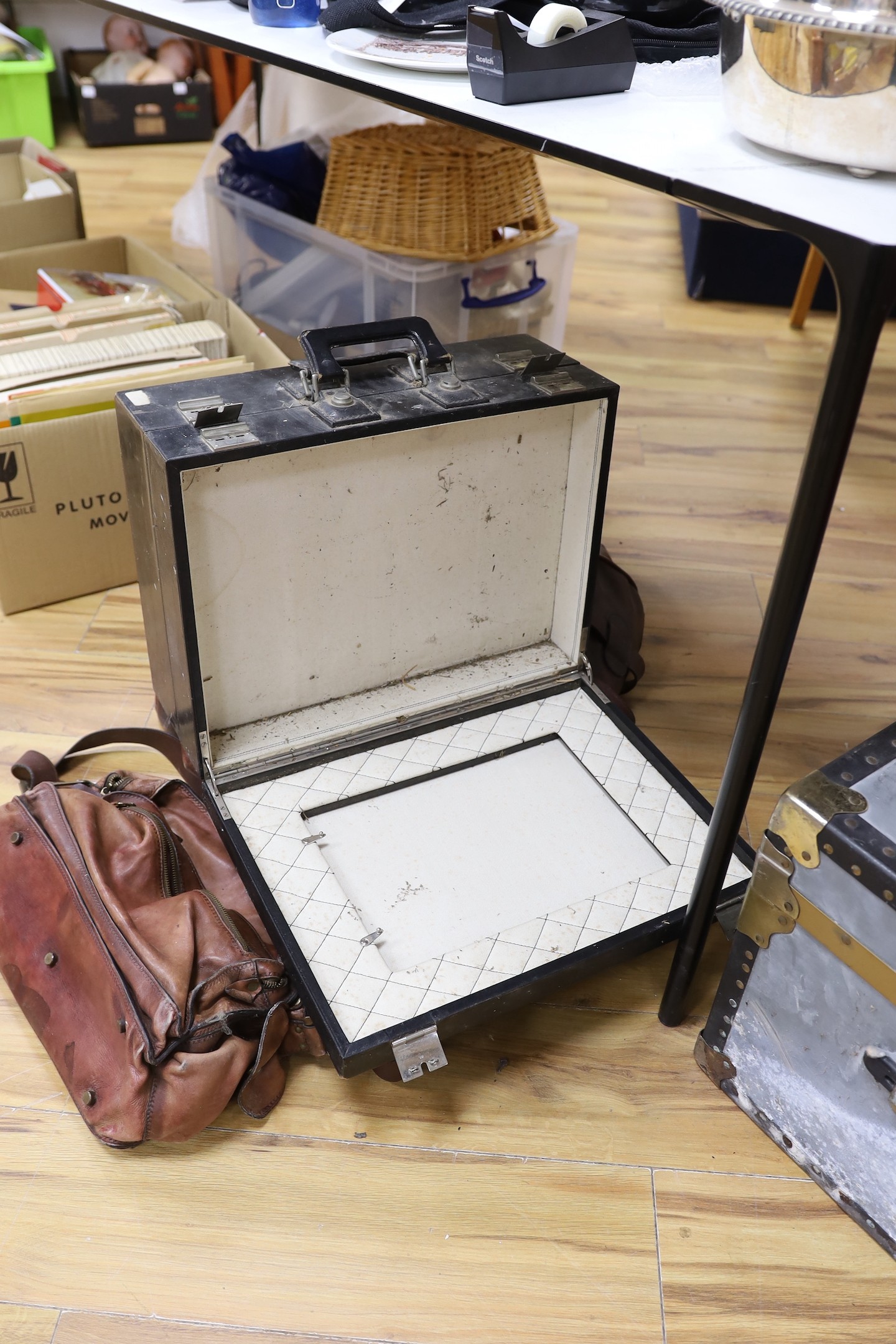 A large brown leather Gladstone bag, a Bally Italian brown leather satchel bag and a compatmental suitcase